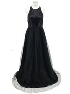 Black evening gown with sequined top on a white background