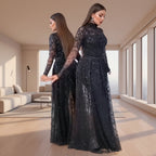 Woman wearing a black sequin dress against a neutral background