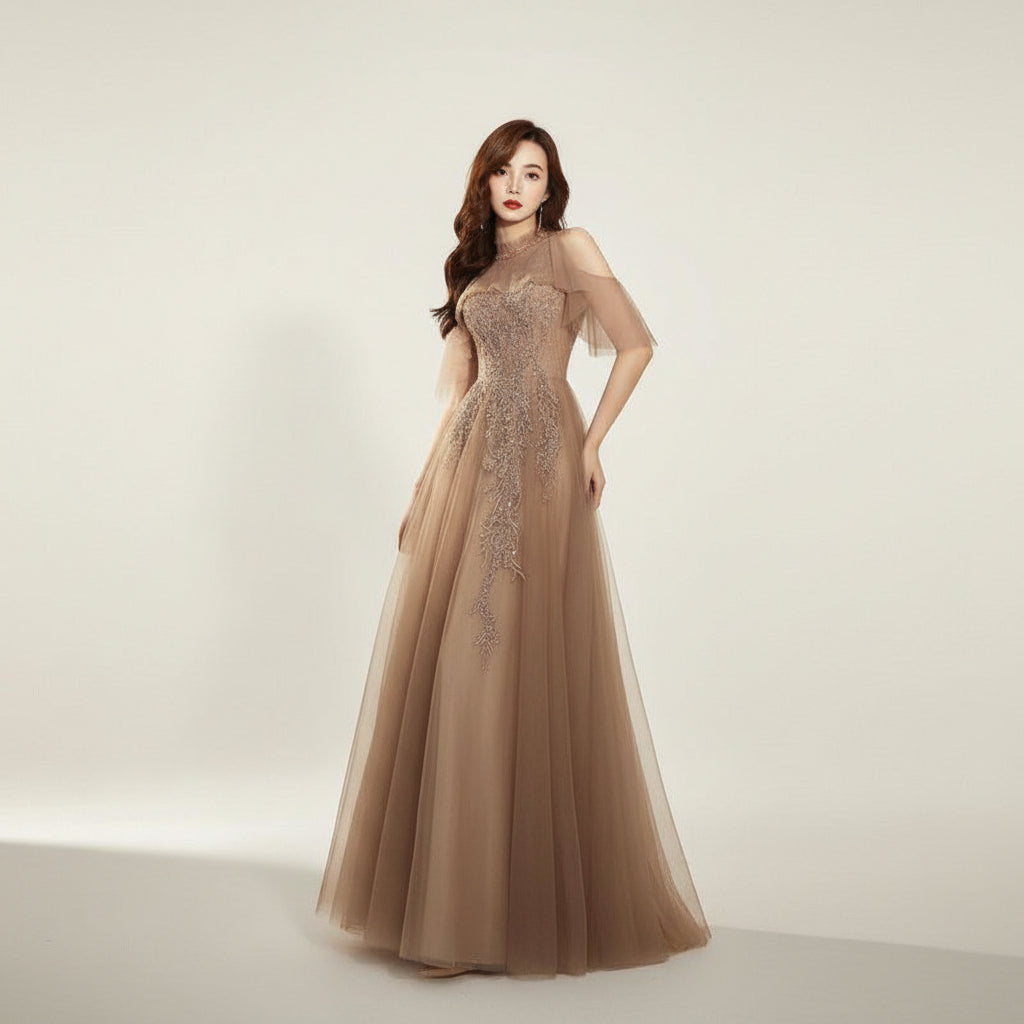 Woman wearing a glamorous dress with intricate detailing against a dark background