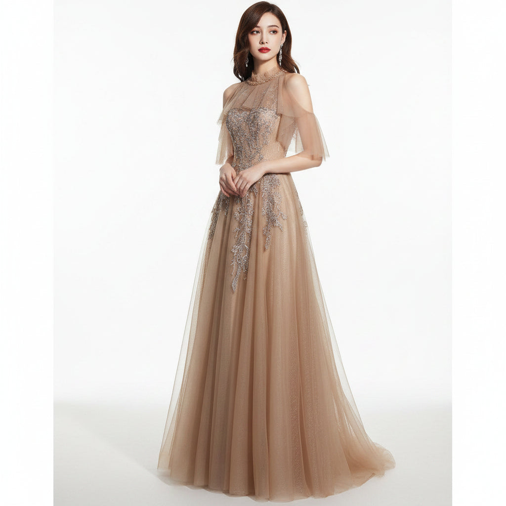Woman wearing a glamorous evening gown with intricate detailing against a dark background