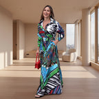 Woman wearing a colorful patterned dress standing on a sidewalk.