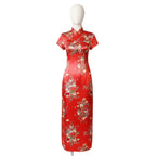 Red traditional garment with floral patterns on a plain background