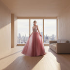 Pink evening gown with beaded top on a model against a white curtain background