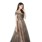 Woman in a glamorous evening gown with sequin details against a plain background