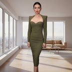 Person wearing a green dress in an indoor setting