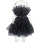Black tulle dress on a mannequin against a white background