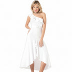 Woman wearing a white one-shoulder dress on a white background